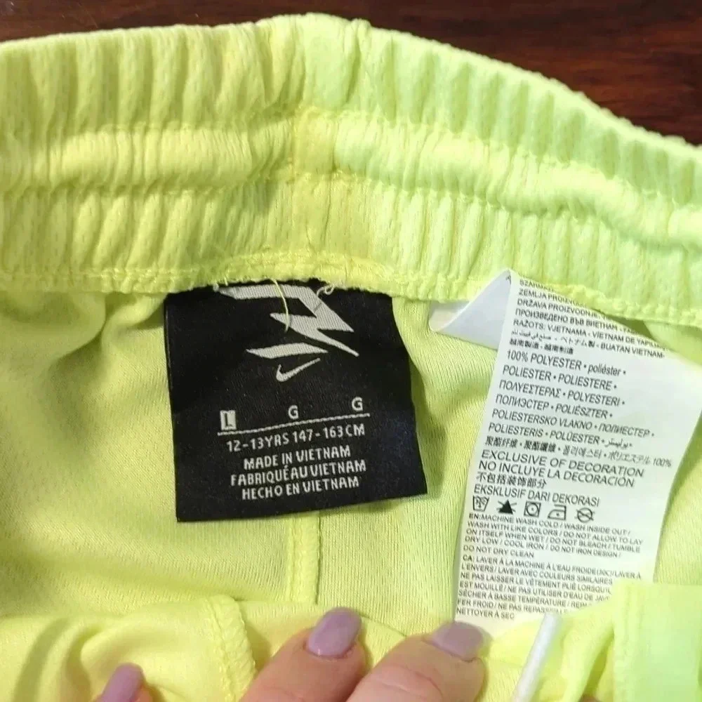 BOYS neon green Nike shorts